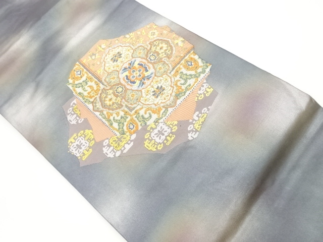 華文に抽象草花模様織出し名古屋帯